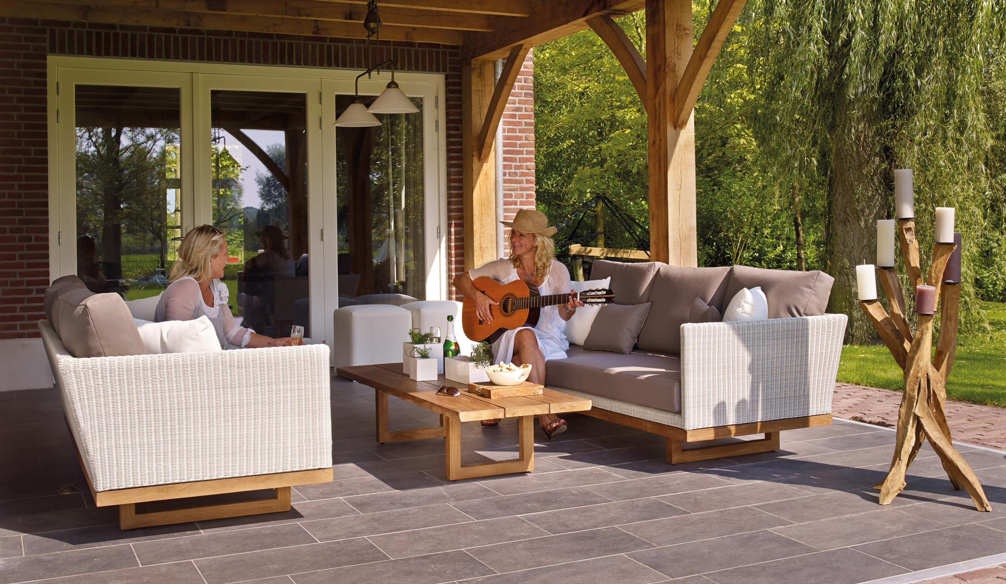 Two women enjoying their leisure time on a patio