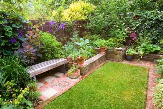 Bricks flower beds with surrounding plants