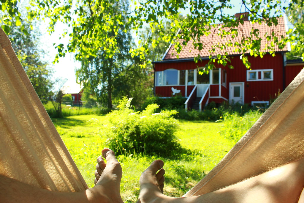 A view of a person's feet in the garden hammock