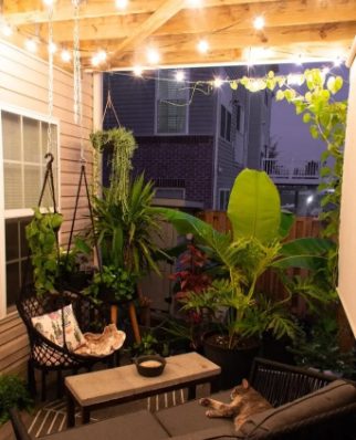 Globe string lights into the mix of a small patio, lighting up the mood