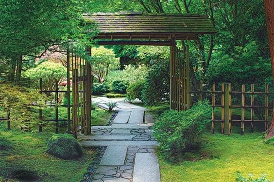 A zen garden with a traditional Japanese gate