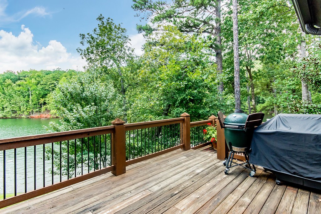 BBQ area on deck with lake view