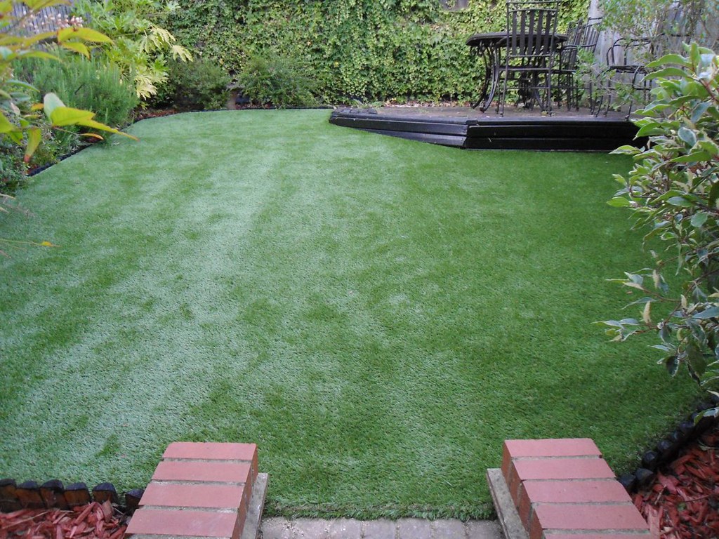 Open backyard with artificial grass