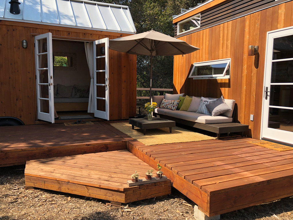 Small garden patio decking with small shed