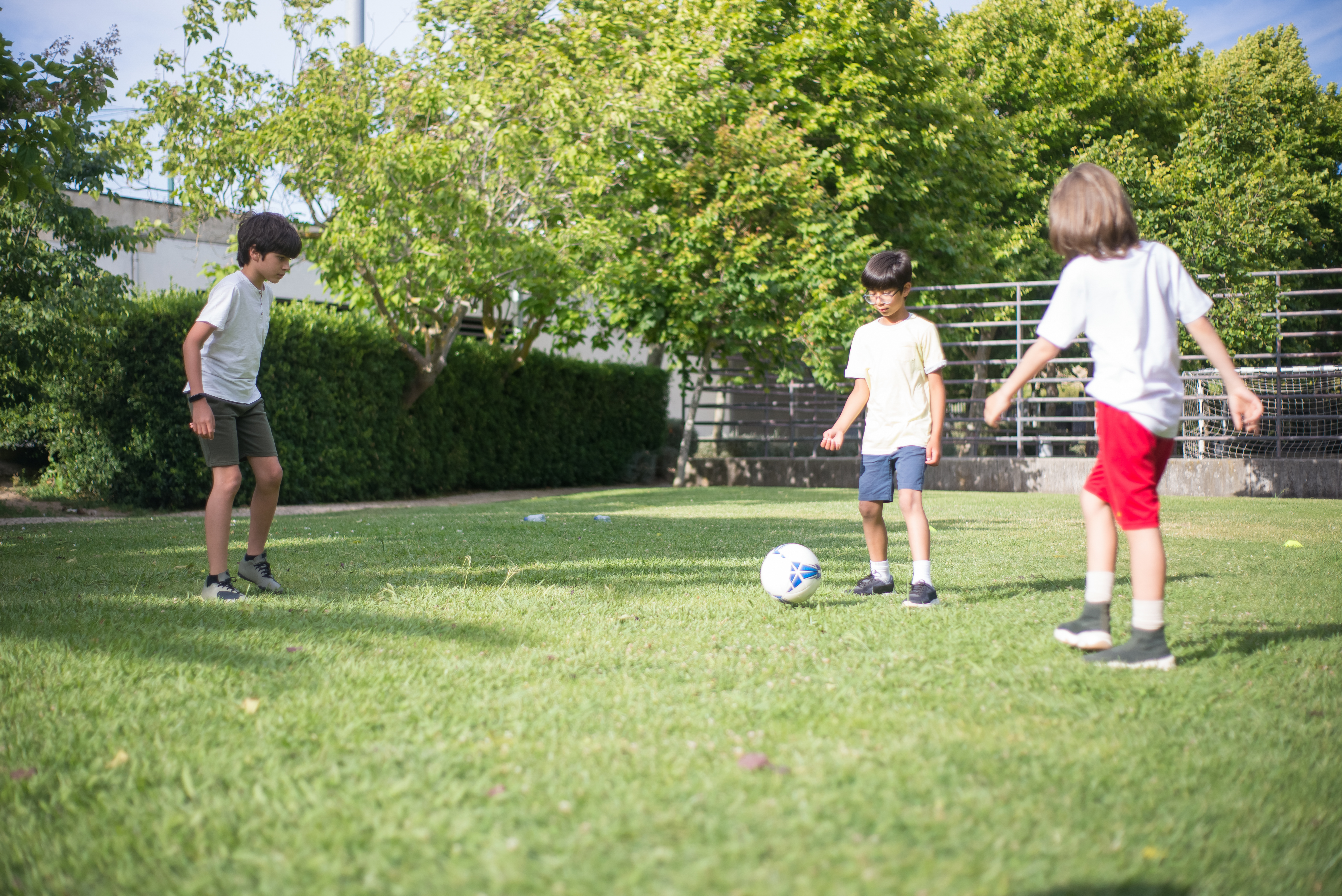 Children playing football in the garden