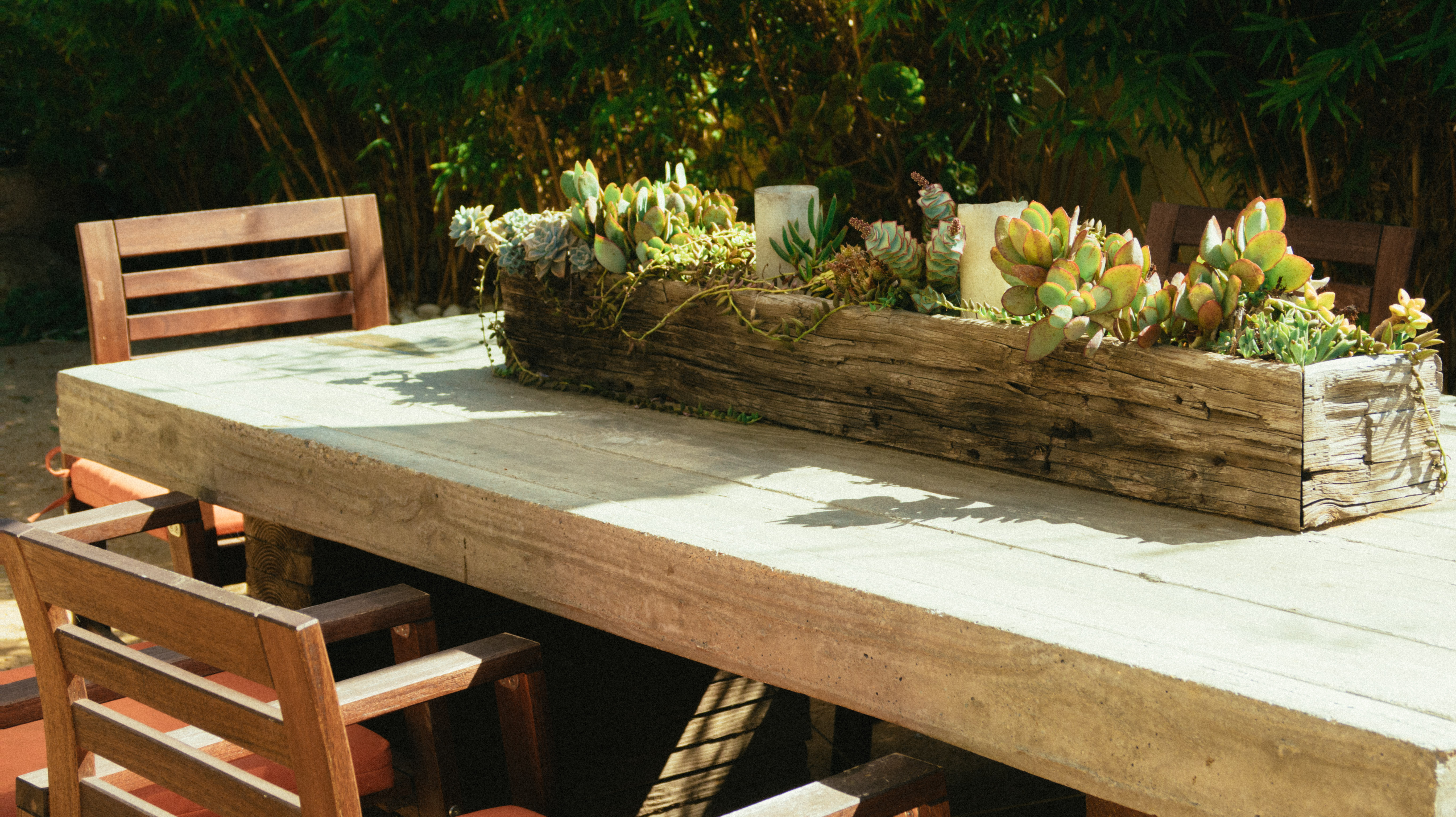 DIY garden table with herb planter at the centre