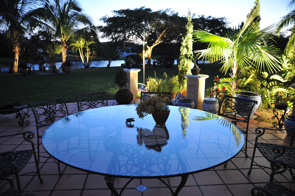 Round glass topped garden table