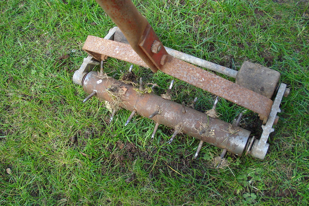 Aerating the lawn using an aeration tool